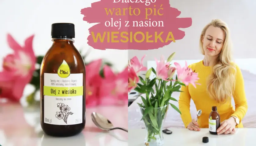 Kobieta z blond włosami w żółtym swetrze trzyma butelkę oleju z wiesiołka. Obok wazon z różowymi liliami. Napis: "Dlaczego warto pić olej z nasion WIESIOŁKA".