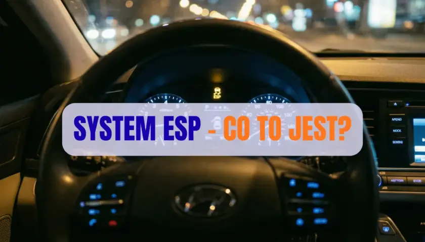 Widok na deskę rozdzielczą samochodu nocą. Na wyświetlaczu świeci się kontrolka ESP, a na kierownicy napis "SYSTEM ESP - CO TO JEST?".