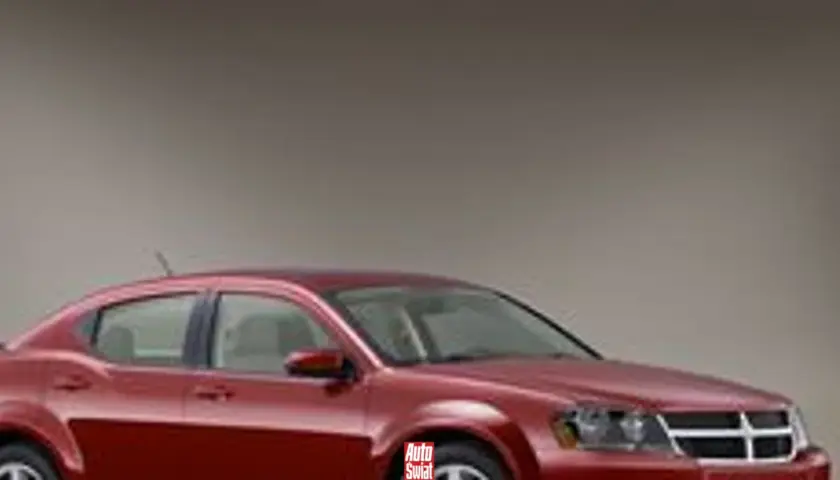 Czerwony Dodge Avenger, model z linii stratus, prezentuje się elegancko na neutralnym tle.