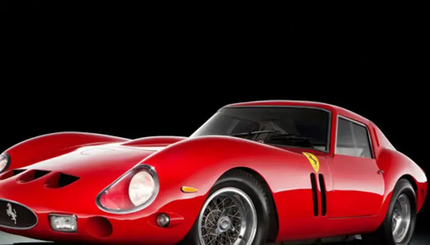 Ikoniczny czerwony Ferrari 250 GTO z lat 60. na czarnym tle.