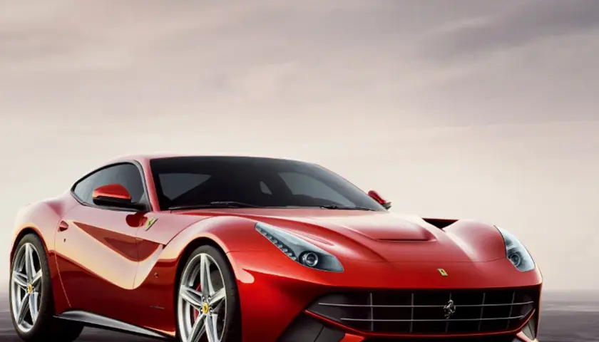 Czerwone Ferrari F12 Berlinetta lśni w słońcu, gotowe do jazdy.