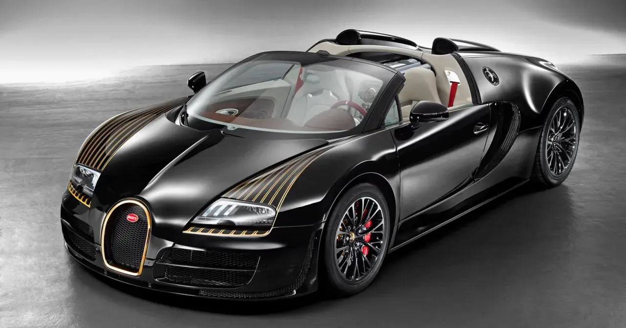 Czarny Bugatti z złotymi pasami, otwarty dach, skórzane wnętrze. Zastanawiasz się, ile kosztuje Bugatti?