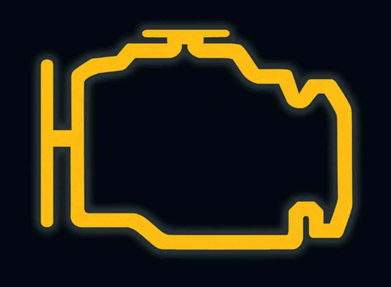 Żółty symbol silnika na ciemnym tle. Dowiedz się, jak skasować błąd check engine bez komputera, gdy pojawi się ten sygnał.
